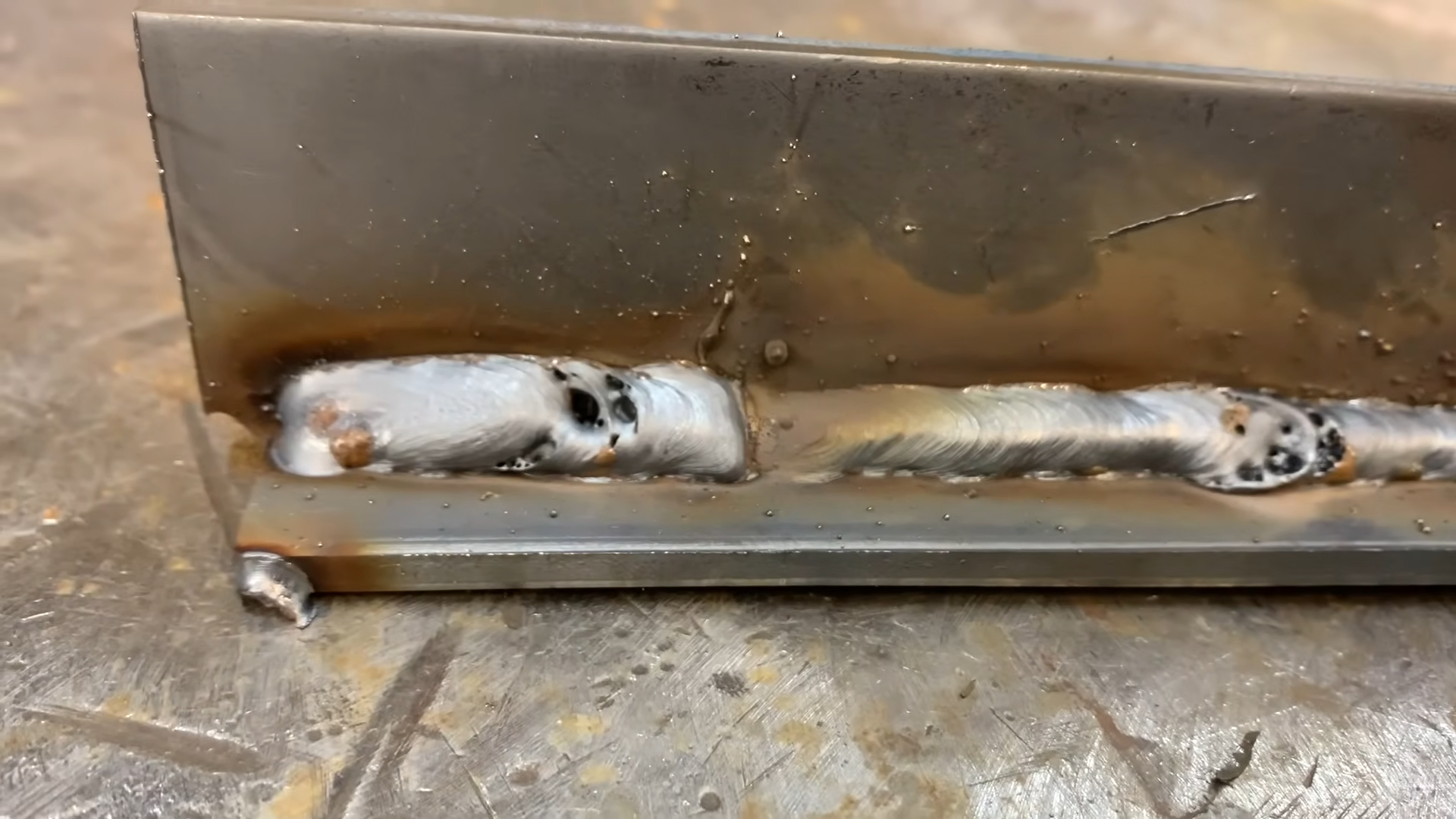 Porous MIG weld showing gas pockets and contamination defects