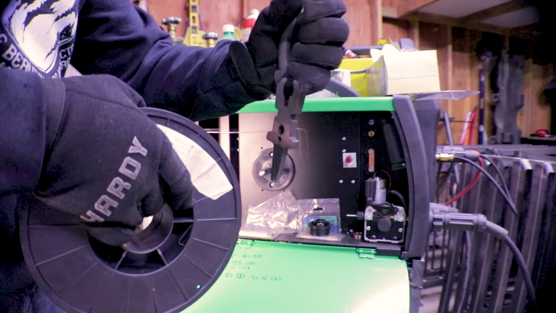 MIG welding wire spool showing wire size and type for consumption calculations