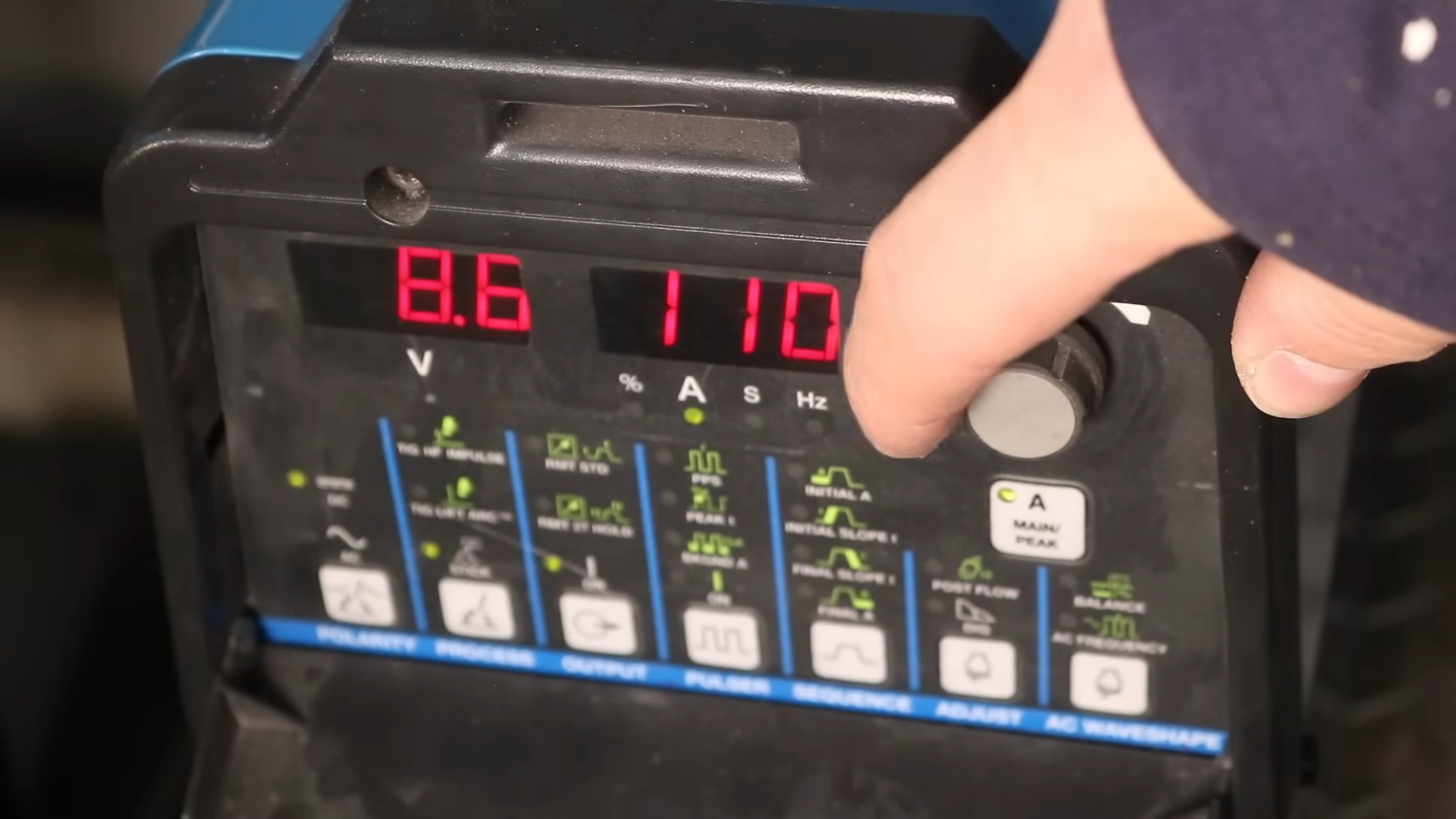Stick welder control panel showing amperage settings for power consumption calculations