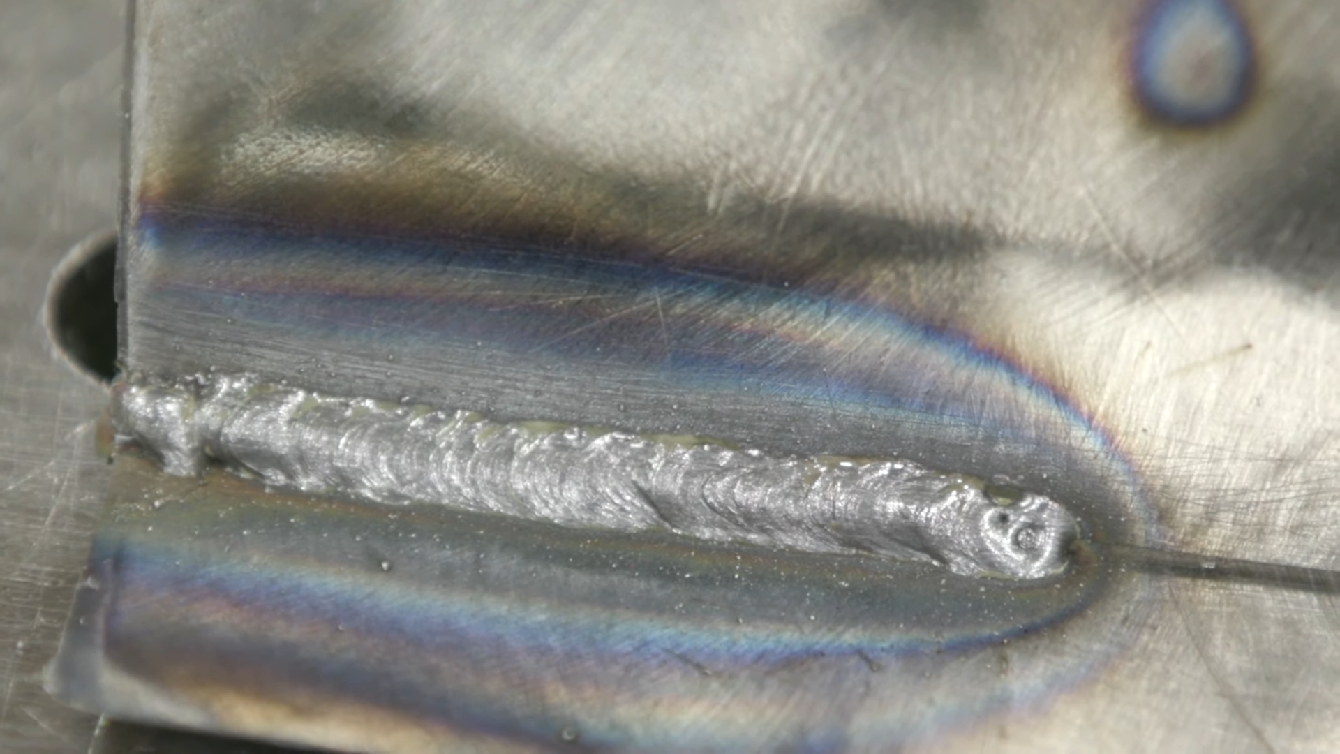 Close-up of MIG weld bead showing proper penetration and bead profile