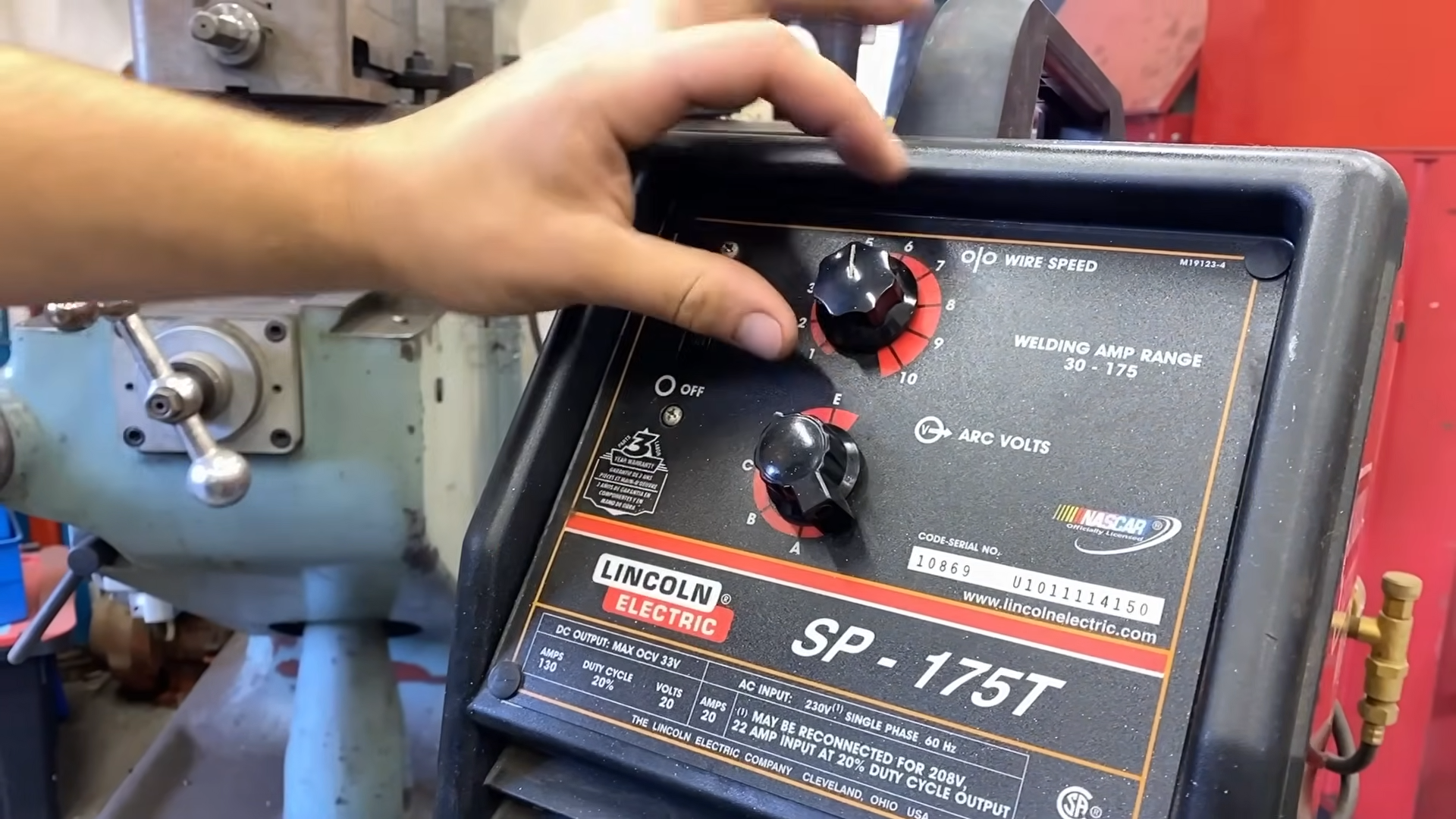 MIG welder setup showing power requirements and electrical connections for cost calculations