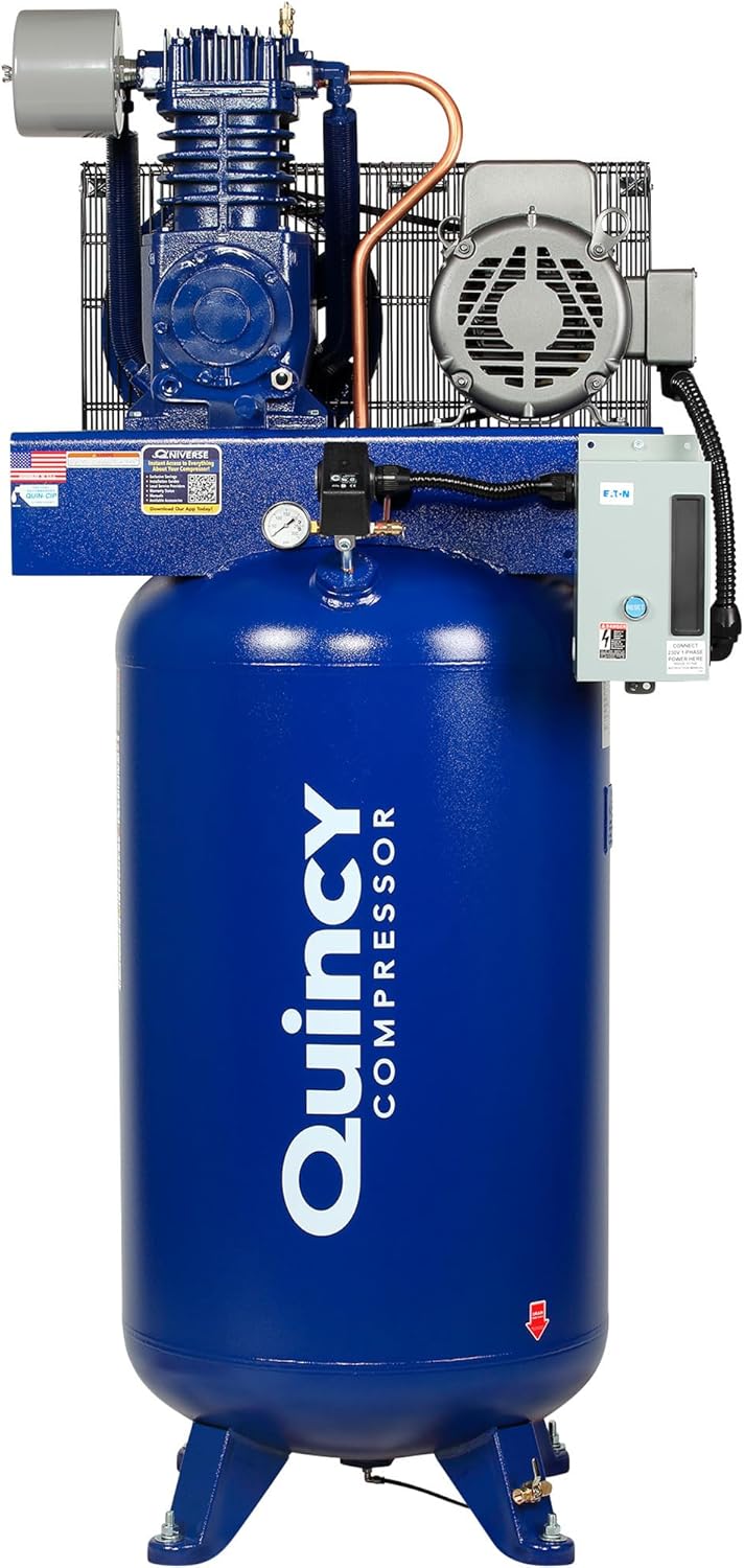 Quincy QT-7.5 professional air compressor with large tank capacity showing vertical tank design for shop use