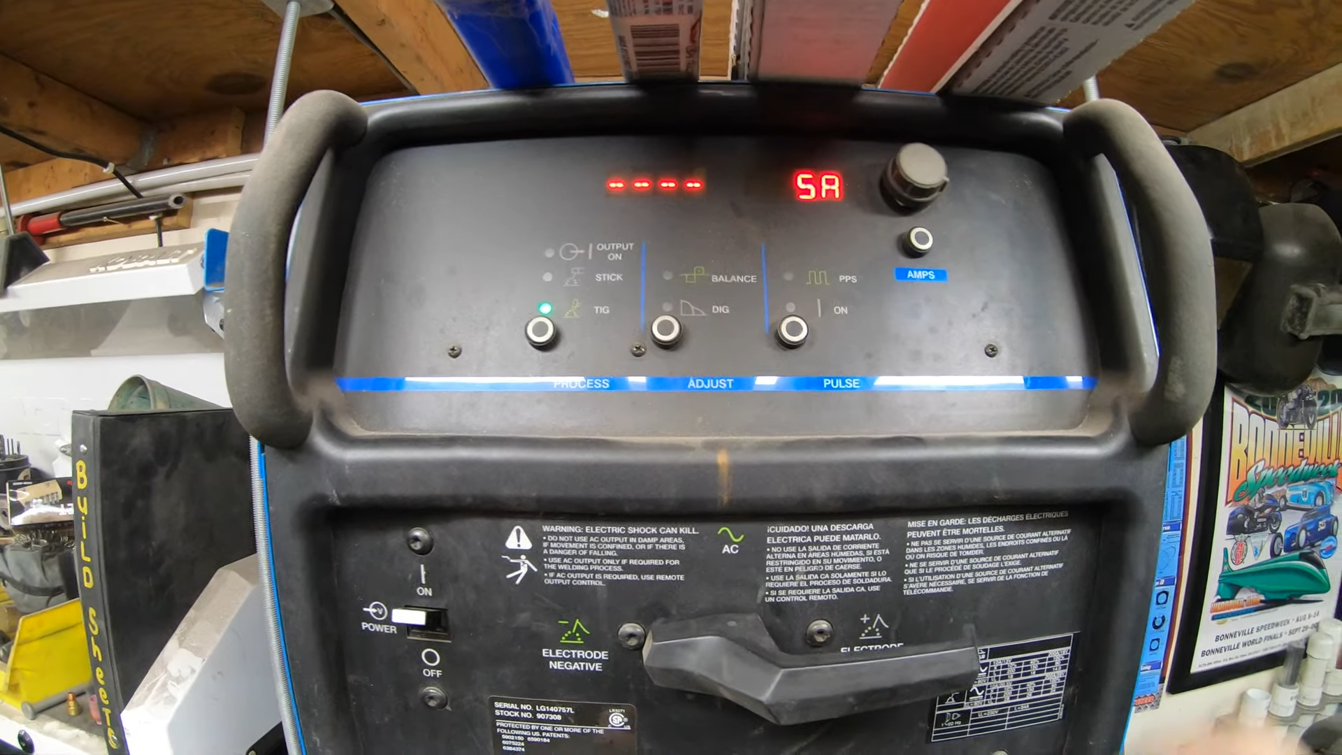 TIG welder setup showing power requirements and control settings for electricity cost estimation