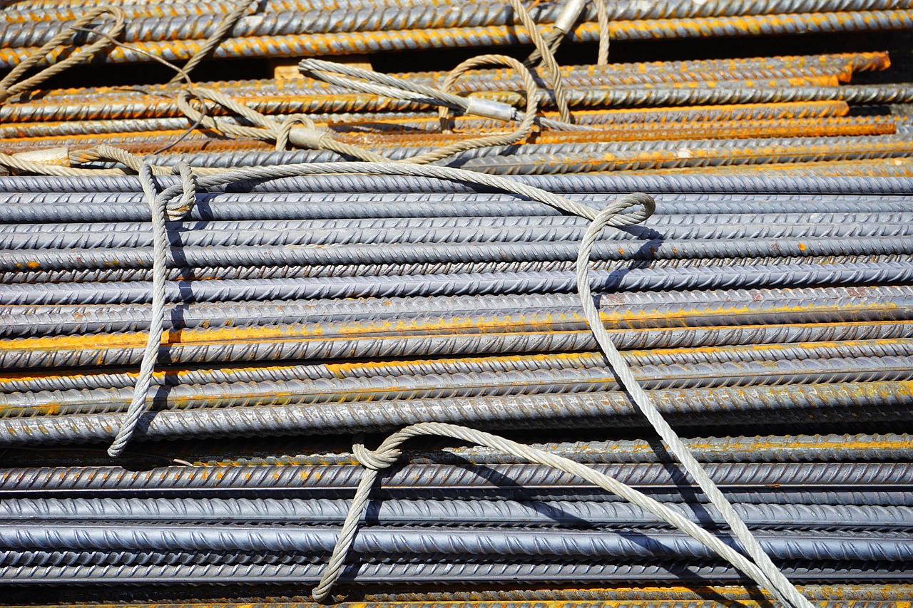 Steel round bar and rod stock showing various diameters used in metal weight calculations