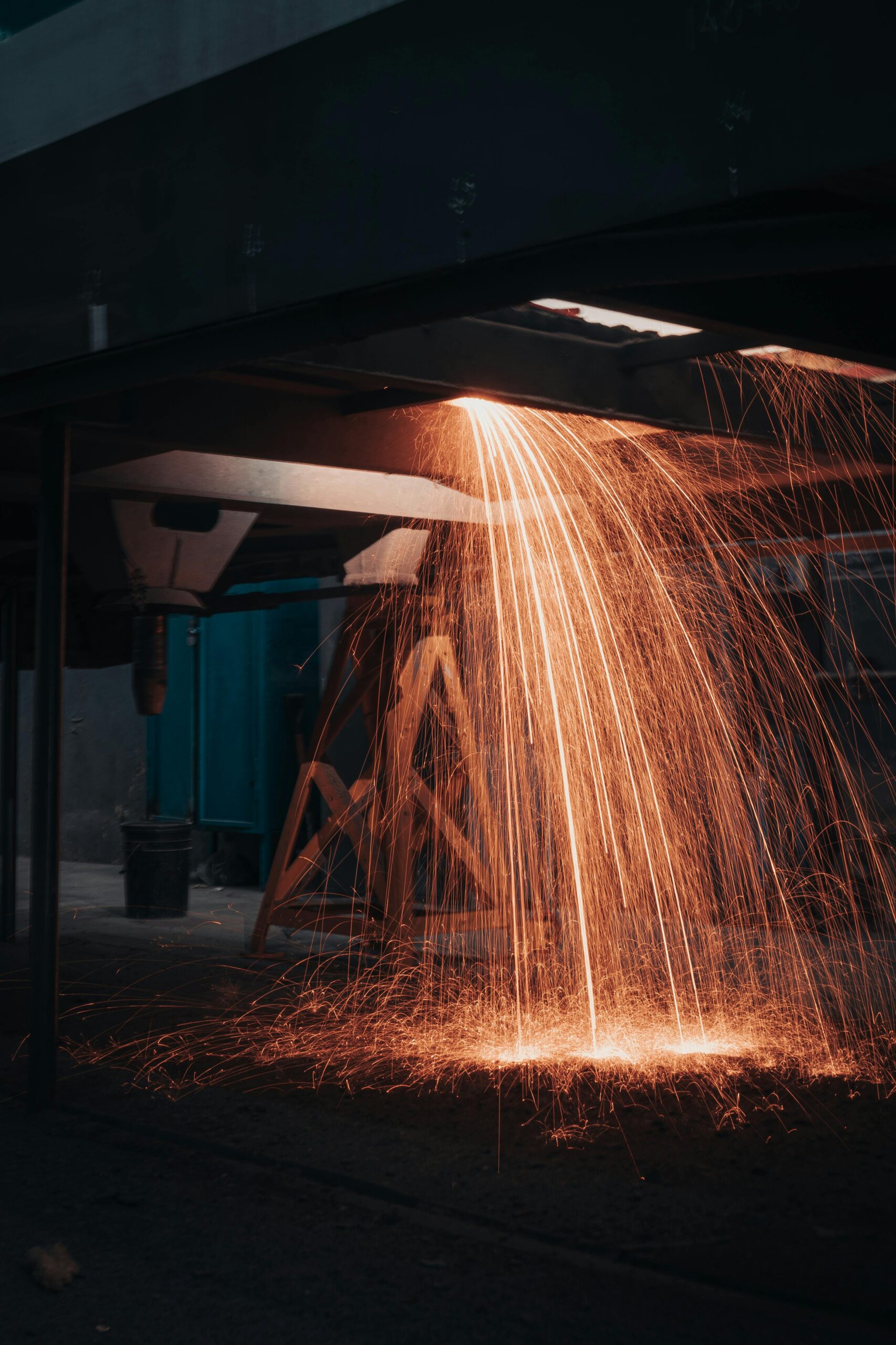 Sparks from welding showing material consumption and deposition process