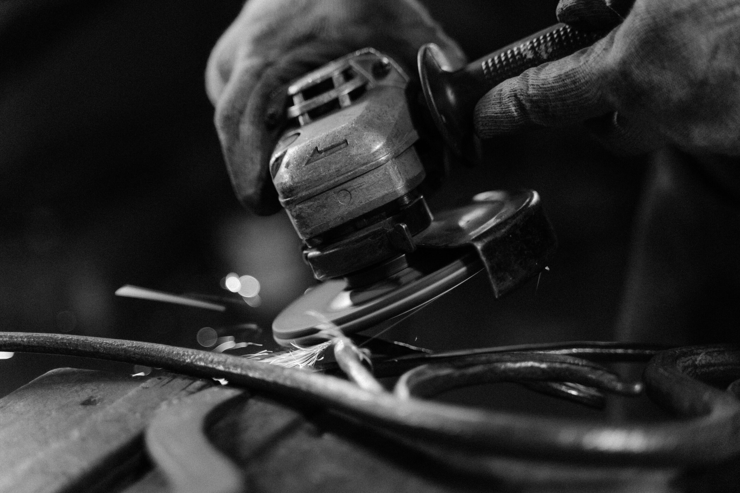 Angle grinder in operation showing proper disc speed and sparks indicating correct RPM to SFPM ratio