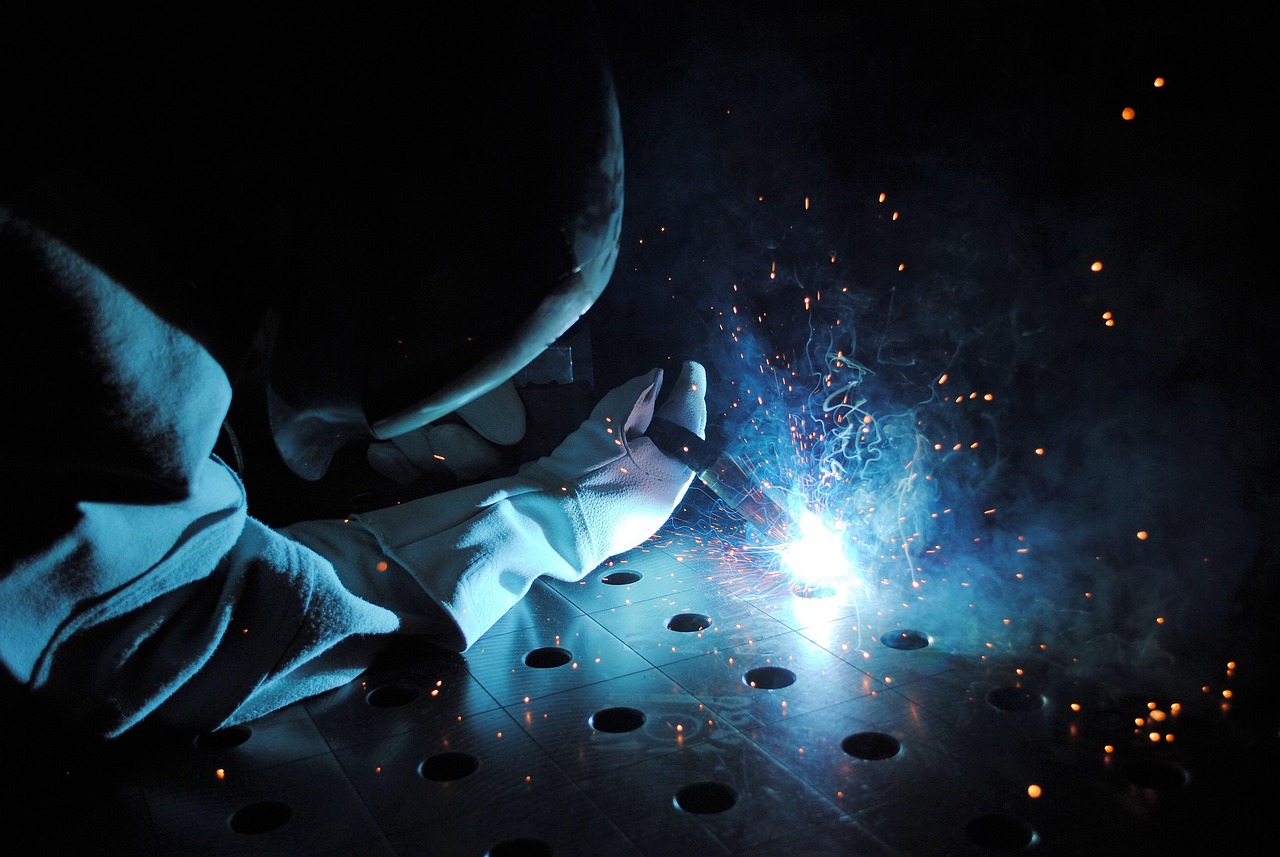 MIG welding in progress showing proper amperage heat input and weld puddle control