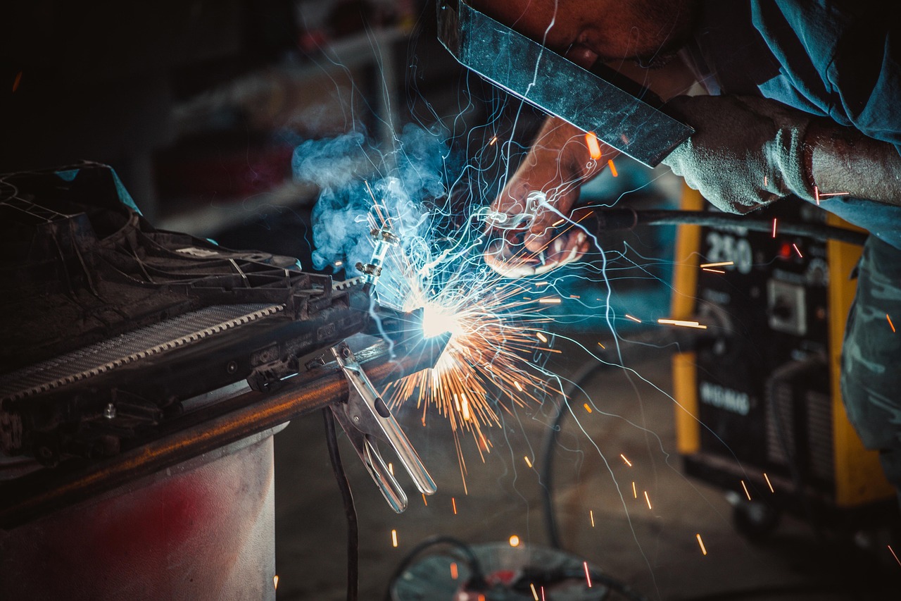 Stick welding showing proper amperage and technique for structural steel fabrication